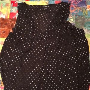 Black sleeveless blouse with white polka dots